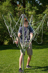 A man opening a Deluxe DS9 Sunshine Clothesline