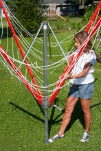 Load image into Gallery viewer, A young lady opening her Sunshine Clothesline getting it ready to use. 